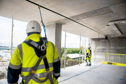Installing compression posts and safety barriers with Scissorsafe personal fall protection system